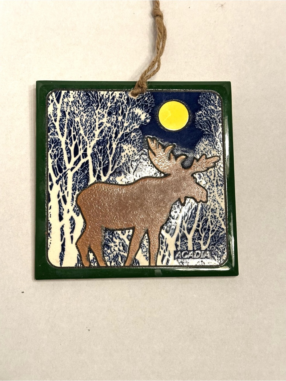 Arcadia Brown Moose Ceramic Hanging Ornament with Green Frame and Blue Night